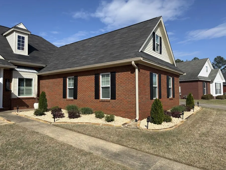 Brick house with fresh mulch beds